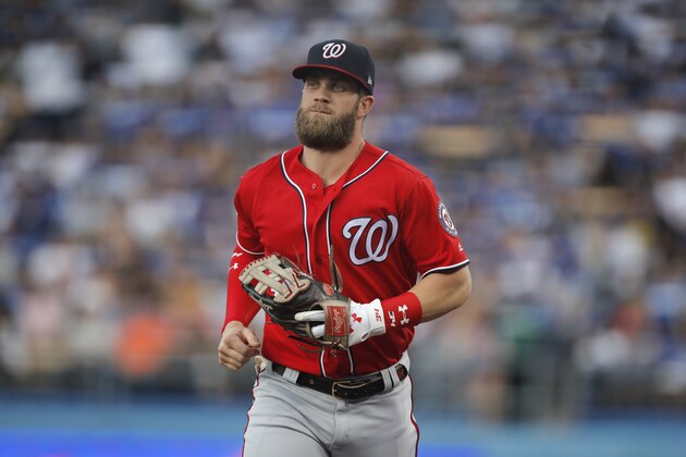 Washington Nationals' Bryce Harper heads to the dugout after the third inning of a baseball game against the Los Angeles Dodgers, Saturday, April 21, 2018, in Los Angeles. (AP Photo/Jae C. Hong)
