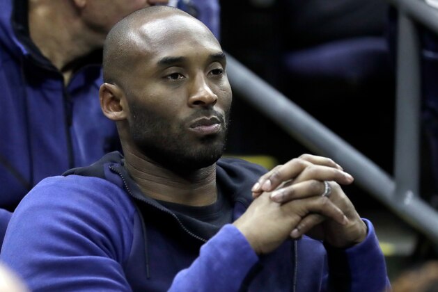 Former Los Angeles Lakers' Kobe Bryant watches from the stands during the first half in the semifinals of the women's NCAA Final Four college basketball tournament game between Connecticut and Notre Dame, Friday, March 30, 2018, in Columbus, Ohio. (AP Photo/Ron Schwane)
