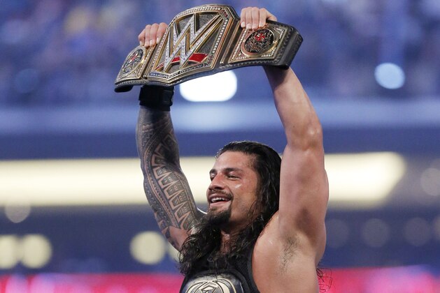 IMAGE DISTRIBUTED FOR WWE - WWE superstar new world heavy weight champion Roman Reigns celebrates his victory at WrestleMania 32 at AT&T Stadium on Sunday, April 3, 2016, in Arlington, Texas. (Brandon Wade/AP Images for WWE)