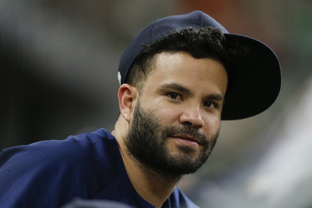 HOUSTON, TX - AUGUST 09:  Jose Altuve #27 of the Houston Astros looks on from the bench at Minute Maid Park on August 9, 2018 in Houston, Texas.  (Photo by Bob Levey/Getty Images)