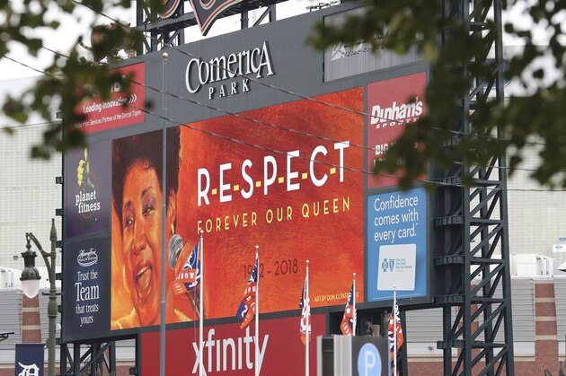 The scoreboard at Comerica Park, home of the Detroit Tigers, displays a tribute to Aretha Franklin, Thursday, Aug. 16, 2018, in Detroit. Franklin died Thursday at her home in Detroit. She was 76. (AP Photo/Carlos Osorio)
