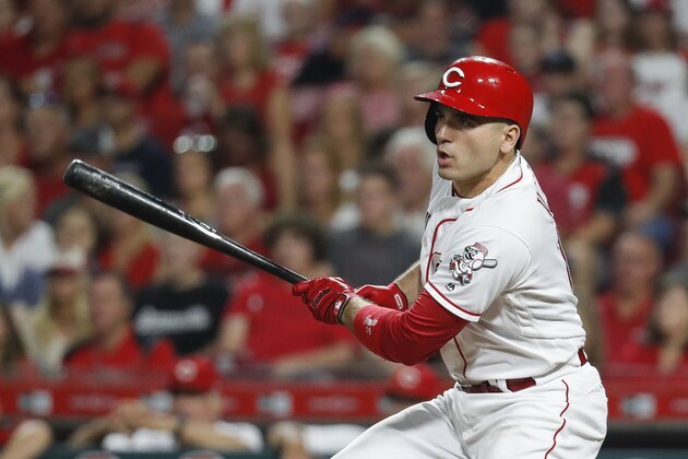Cincinnati Reds' Joey Votto hits an RBI single off Arizona Diamondbacks relief pitcher T.J. McFarland in the eighth inning of a baseball game, Saturday, Aug. 11, 2018, in Cincinnati. (AP Photo/John Minchillo)