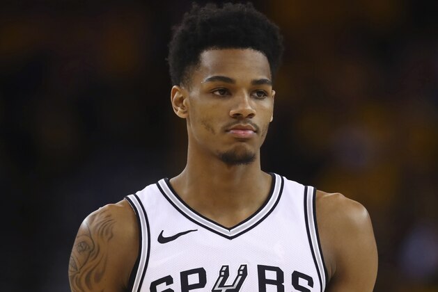 San Antonio Spurs' Dejounte Murray walks off the court during a timeout in the final minutes in Game 2 of a first-round NBA basketball playoff series against the Golden State Warriors, Monday, April 16, 2018, in Oakland, Calif. Golden State won 116-101. (AP Photo/Ben Margot)
