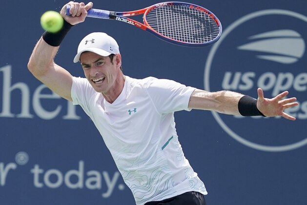 Andy Murray, of Great Britain, returns to Lucas Pouille, of France, in the first round at the Western & Southern Open, Monday, Aug. 13, 2018, in Mason, Ohio. (AP Photo/John Minchillo)