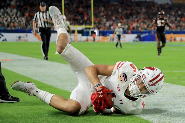 MIAMI GARDENS, FL - DECEMBER 30:  Danny Davis III #6 of the Wisconsin Badgers scores a touchdown during the 2017 Capital One Orange Bowl against the Miami Hurricanesat Hard Rock Stadium on December 30, 2017 in Miami Gardens, Florida.  (Photo by Mike Ehrmann/Getty Images)