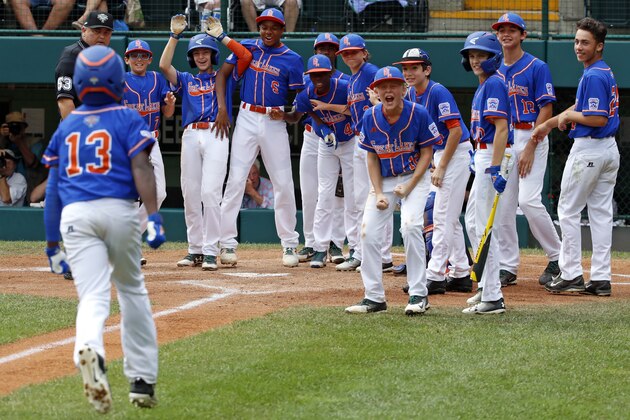Grosse Pointe Woods, Michigan's Oliver Service (13) rounds third base after hitting a two-run home run off Peachtree City, Georgia's Jansen Kenty (16) in the second first inning of an elimination baseball game in United States pool play at the Little League World Series tournament in South Williamsport, Pa., Wednesday, Aug. 22, 2018. (AP Photo/Gene J. Puskar)