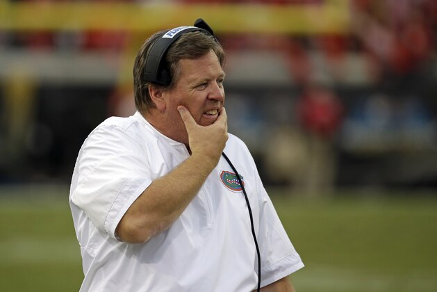 Florida head coach Jim McElwain walks the sideline in the second half of an NCAA college football game against Georgia, Saturday, Oct. 28, 2017, in Jacksonville, Fla. Georgia won 42-7. (AP Photo/John Raoux)