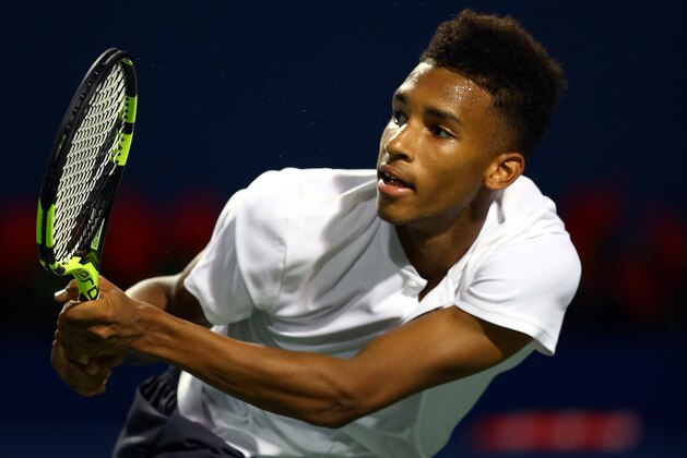 TORONTO, ON - AUGUST 08:  Felix Auger-Aliassime of Canada plays a shot against Daniil Medvedev of Russia during a 2nd round match on Day 3 of the Rogers Cup at Aviva Centre on August 8, 2018 in Toronto, Canada.  (Photo by Vaughn Ridley/Getty Images)