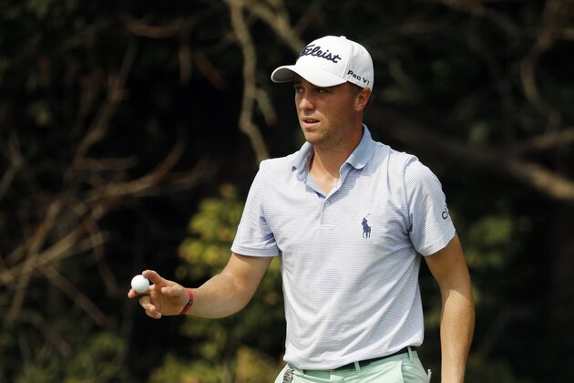 Justin Thomas walks off the green after making par on the 13th hole during the final round of the PGA Championship golf tournament at Bellerive Country Club, Sunday, Aug. 12, 2018, in St. Louis. (AP Photo/Charlie Riedel)