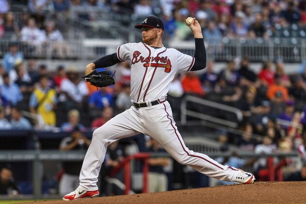Atlanta Braves starting pitcher Sean Newcomb works against the Colorado Rockies in the first inning of a baseball game in Atlanta, Friday, Aug. 17, 2018. (AP Photo/Danny Karnik)