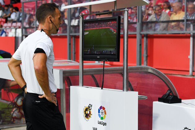 GIRONA, SPAIN - AUGUST 17:  The referee Cuadra Fernandez checks the VAR system prior to the La Liga match between Girona FC and Real Valladolid CF at Montilivi Stadium on August 17, 2018 in Girona, Spain.  (Photo by David Ramos/Getty Images)