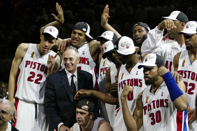 Detroit Pistons coach Larry Brown and his players celebrate the Piston 100-87 victory over the Los Angeles Lakers in  Game 5 of the NBA Finals in Auburn Hills, Mich. Tuesday night June 15, 2004.  Joining Brown are, Tayshaun Prince  (22)  Corliss Williamson, rear, and Rasheed Wallace (30) .(AP Photo/ Michael Conroy )