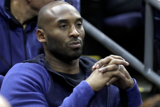 Former Los Angeles Lakers' Kobe Bryant watches from the stands during the first half in the semifinals of the women's NCAA Final Four college basketball tournament game between Connecticut and Notre Dame, Friday, March 30, 2018, in Columbus, Ohio. (AP Photo/Ron Schwane)