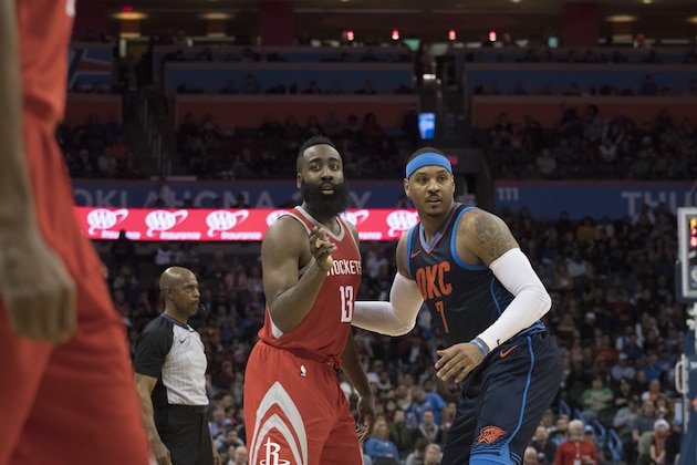 OKLAHOMA CITY, OK - DECEMBER 25: James Harden #13 of the Houston Rockets and Carmelo Anthony #7 of the Oklahoma City Thunder during the second half of a NBA  game at the Chesapeake Energy Arena on December 25, 2017 in Oklahoma City, Oklahoma. The Thunder defeated the Rockets 112-107. NOTE TO USER: User expressly acknowledges and agrees that, by downloading and or using this photograph, User is consenting to the terms and conditions of the Getty Images License Agreement. (Photo by J Pat Carter/Getty Images)