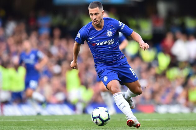 Chelsea's Belgian midfielder Eden Hazard runs with the ball during the English Premier League football match between Chelsea and Arsenal at Stamford Bridge in London on August 18, 2018. (Photo by Glyn KIRK / AFP) / RESTRICTED TO EDITORIAL USE. No use with unauthorized audio, video, data, fixture lists, club/league logos or 'live' services. Online in-match use limited to 120 images. An additional 40 images may be used in extra time. No video emulation. Social media in-match use limited to 120 images. An additional 40 images may be used in extra time. No use in betting publications, games or single club/league/player publications. /         (Photo credit should read GLYN KIRK/AFP/Getty Images)