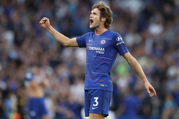 Chelsea's Spanish defender Marcos Alonso celebrates on the final whistle in the English Premier League football match between Chelsea and Arsenal at Stamford Bridge in London on August 18, 2018. - Chelsea won the game 3-2. (Photo by Daniel LEAL-OLIVAS / AFP) / RESTRICTED TO EDITORIAL USE. No use with unauthorized audio, video, data, fixture lists, club/league logos or 'live' services. Online in-match use limited to 120 images. An additional 40 images may be used in extra time. No video emulation. Social media in-match use limited to 120 images. An additional 40 images may be used in extra time. No use in betting publications, games or single club/league/player publications. /         (Photo credit should read DANIEL LEAL-OLIVAS/AFP/Getty Images)