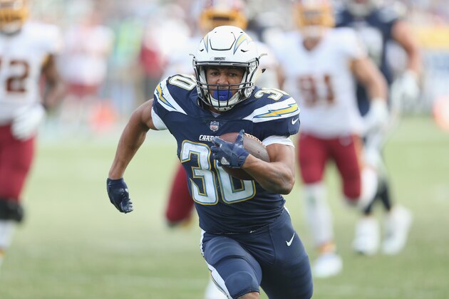 CARSON, CA - DECEMBER 10:  Running back Austin Ekeler #30 of the Los Angeles Chargers carries the ball on a  33 yard run down to the Washington Redskins four yard line on the final play of the first half on December 10, 2017 at StubHub Center in Carson, California.  (Photo by Stephen Dunn/Getty Images)