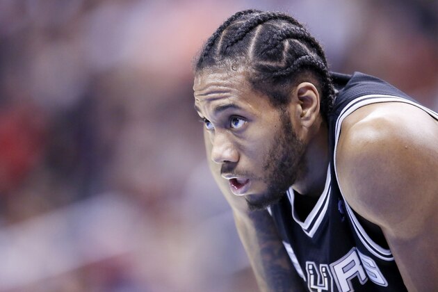 LOS ANGELES, CA - DECEMBER 16: San Antonio Spurs small forward Kawhi Leonard (2) rests during the Los Angeles Clippers 115-92 victory over the San Antonio Spurs at the Staples Center at the Staples Center on December 16, 2013 in Los Angeles, California. NOTE TO USER: User expressly acknowledges and agrees that, by downloading and or using this photograph, User is consenting to the terms and conditions of the Getty Images License Agreement. (Photo by Chris Elise/Getty Images)