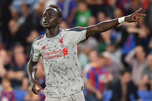 Liverpool's Senegalese striker Sadio Mane celebrates scoring their second goal during the English Premier League football match between Crystal Palace and Liverpool at Selhurst Park in south London on August 20, 2018. (Photo by Glyn KIRK / AFP) / RESTRICTED TO EDITORIAL USE. No use with unauthorized audio, video, data, fixture lists, club/league logos or 'live' services. Online in-match use limited to 120 images. An additional 40 images may be used in extra time. No video emulation. Social media in-match use limited to 120 images. An additional 40 images may be used in extra time. No use in betting publications, games or single club/league/player publications. /         (Photo credit should read GLYN KIRK/AFP/Getty Images)