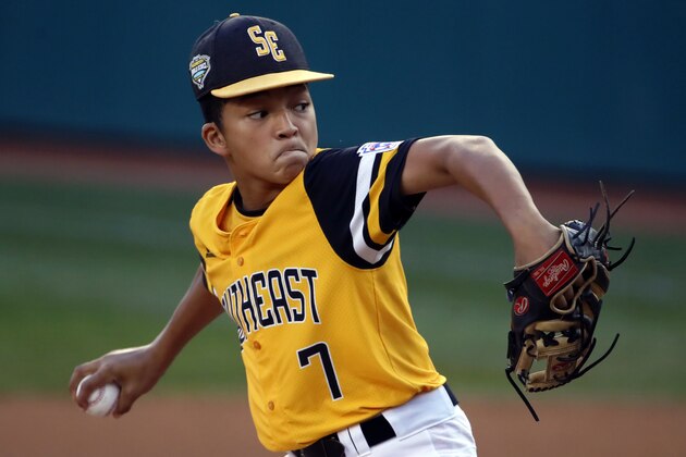 Peachtree City, Georgia's Tai Peete delivers in the first inning against Staten Island (N.Y.) at the Little League World Series baseball tournament in South Williamsport, Pa., Thursday, Aug. 23, 2018. (AP Photo/Gene J. Puskar)