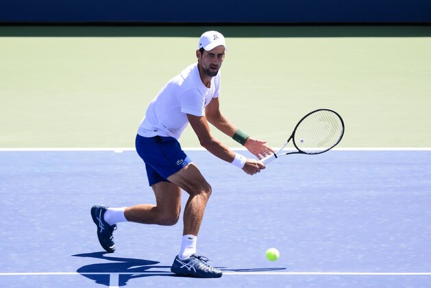 NEW YORK, NY - AUGUST 23: Novak Djokovic of Serbia practices with Alexander Zverev of Germany before the start of the US Open at the USTA Billie Jean King National Tennis Centre on August 23, 2018 in New York City, United States. (Photo by TPN/Getty Images)