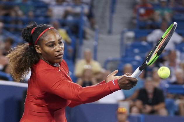 Serena Williams returns to Petra Kvitova, of the Czech Republic, at the Western & Southern Open tennis tournament, Tuesday, Aug. 14, 2018, in Mason, Ohio. (AP Photo/John Minchillo)