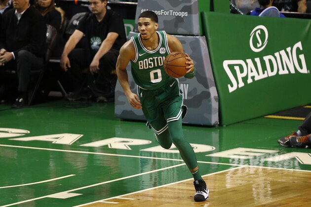 Boston Celtics' Jayson Tatum brings the ball up court against the Los Angeles Lakers during the first quarter of an NBA basketball game in Boston Wednesday, Nov. 8, 2017. (AP Photo/Winslow Townson)