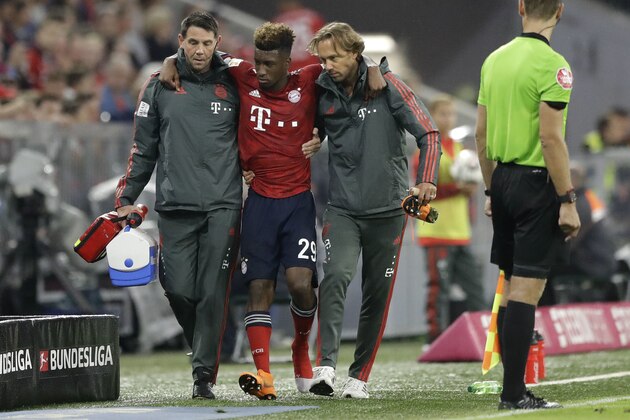 Bayern's Kingsley Coman leaves injured the field during the German Bundesliga soccer match between FC Bayern Munich and TSG 1899 Hoffenheim in Munich, Germany, Friday, Aug. 24, 2018. (AP Photo/Matthias Schrader)
