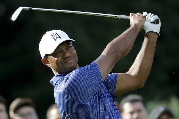 Tiger Woods tees off on the 12th hole during the first round of the Northern Trust golf tournament, Thursday, Aug. 23, 2018, in Paramus, N.J. (AP Photo/Julio Cortez)