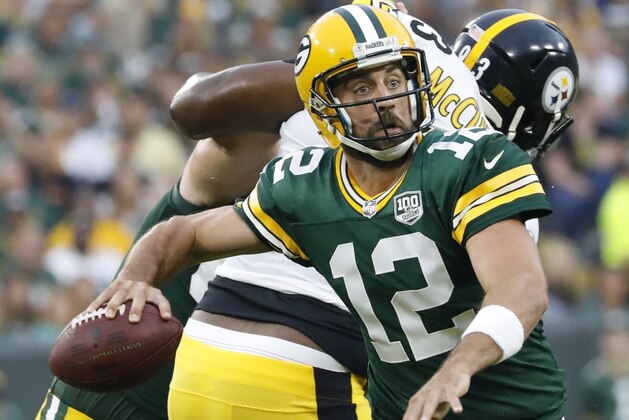 Green Bay Packers' Aaron Rodgers throws during the first half of a preseason NFL football game against the Pittsburgh Steelers Thursday, Aug. 16, 2018, in Green Bay, Wis. (AP Photo/Jeffrey Phelps)
