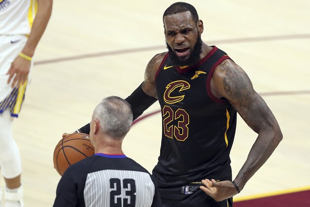 Cleveland Cavaliers' LeBron James argues a call with referee Jason Phillips during the first half of Game 4 of basketball's NBA Finals against the Golden State Warriors, Friday, June 8, 2018, in Cleveland. (AP Photo/Carlos Osorio)
