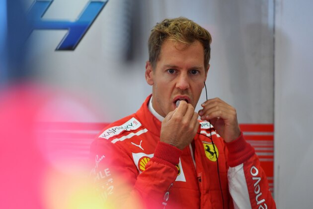 Ferrari's German driver Sebastian Vettel looks on in the pits during the third practice session at the Spa-Francorchamps circuit in Spa on August 25, 2018 ahead of the Belgian Formula One Grand Prix. (Photo by EMMANUEL DUNAND / AFP)        (Photo credit should read EMMANUEL DUNAND/AFP/Getty Images)