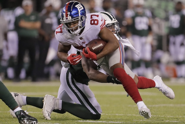 New York Giants wide receiver Sterling Shepard (87) tries to break a tackle by New York Jets linebacker Darron Lee (58) during the second quarter of a preseason NFL football game, Friday, Aug. 24, 2018, in East Rutherford, N.J. (AP Photo/Julio Cortez)