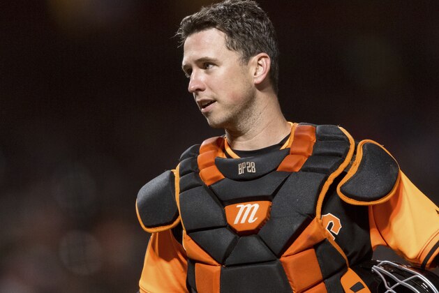 San Francisco Giants catcher Buster Posey talks to an umpire before the pitch against the Texas Rangers in the sixth inning of a baseball game in San Francisco, Friday, Aug 24, 2018. (AP Photo/John Hefti)