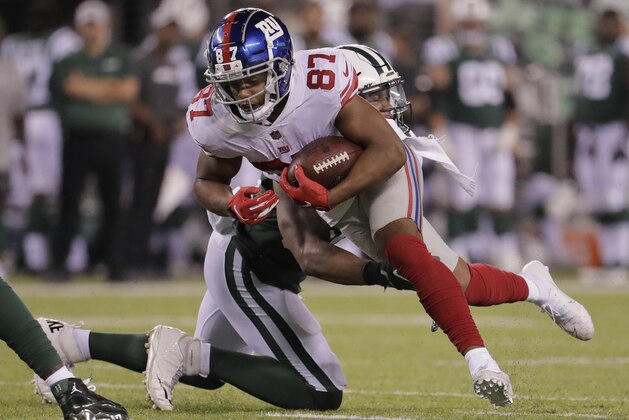 New York Giants wide receiver Sterling Shepard (87) tries to break a tackle by New York Jets linebacker Darron Lee (58) during the second quarter of a preseason NFL football game, Friday, Aug. 24, 2018, in East Rutherford, N.J. (AP Photo/Julio Cortez)