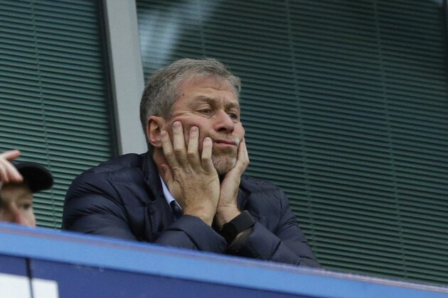 FILE - In this file photo dated Saturday, Dec. 19, 2015, Chelsea soccer club owner Roman Abramovich sits in his box before the English Premier League soccer match between Chelsea and Sunderland at Stamford Bridge stadium in London.  According to a joint statement Monday Aug. 7, 2017, 50-year old Russian tycoon Roman Abramovich and his wife Dasha Zhukova have announced their impending divorce, after ten years together. (AP Photo/Matt Dunham, FILE)