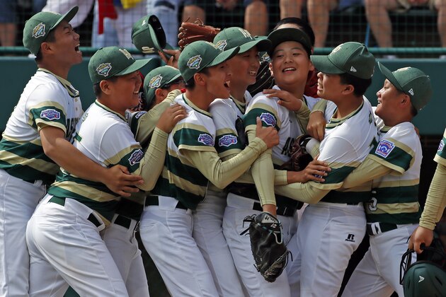 South Korea pitcher Yeong Hyeon Kim, second from right, celebrates with teammates after getting the final out of the International Championship baseball game against Japan at the Little League World Series tournament, Saturday, Aug. 25, 2018, in South Williamsport, Pa. Korea won 2-1. (AP Photo/Gene J. Puskar)