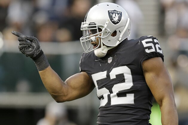 File-This Aug. 19, 2017, file photo shows Oakland Raiders defensive end Khalil Mack (52) against the Los Angeles Rams during an NFL preseason football game in Oakland. The Oakland Raiders are no longer mired in mediocrity thanks to 2016 Defensive Player of the Year Mack and quarterback Derek Carr, who has newfound security in both a shiny $125 million contract and in unretired running back Marshawn Lynch with him in the backfield. (AP Photo/Ben Margot, File)