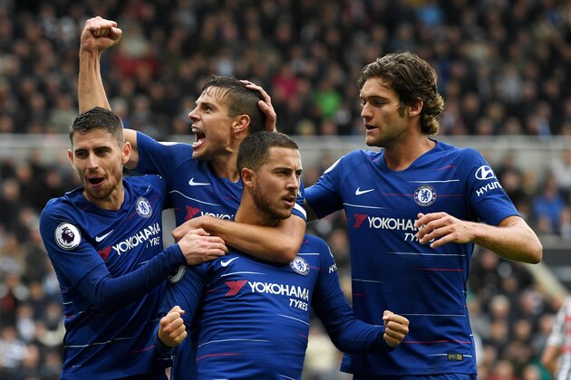 NEWCASTLE UPON TYNE, ENGLAND - AUGUST 26:  Eden Hazard of Chelsea celebrates with teammates after scoring a penalty for his team's first goal during the Premier League match between Newcastle United and Chelsea FC at St. James Park on August 26, 2018 in Newcastle upon Tyne, United Kingdom.  (Photo by Stu Forster/Getty Images)