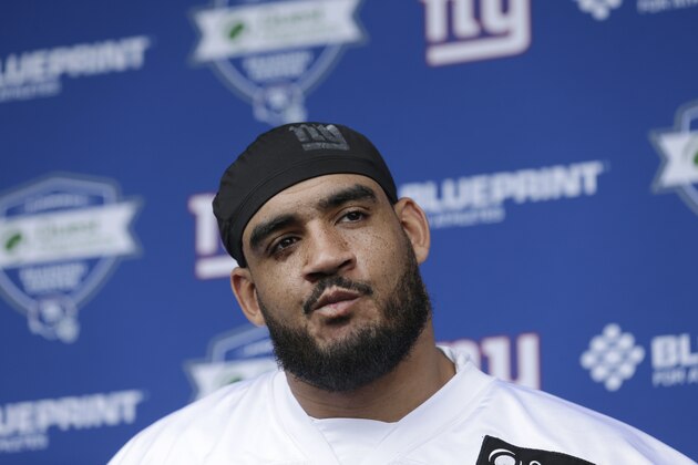 New York Giants' Olivier Vernon speaks to reporters before a NFL football training camp in East Rutherford, N.J., Tuesday, April 24, 2018. (AP Photo/Seth Wenig)