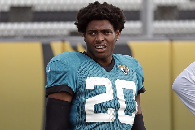 In this July 31, 2018 photo Jacksonville Jaguars cornerback Jalen Ramsey (20) takes a break during a practice at NFL football training camp in Jacksonville, Fla. Ramsey and defensive end Dante Fowler are back from suspension. They were not available during an open locker room session Monday, Aug. 20, 2018. The team says both players will answer questions following Jacksonville's preseason game against the Atlanta Falcons on Saturday night. (AP Photo/John Raoux)