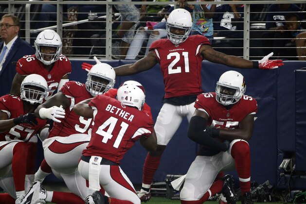 Arizona Cardinals defensive back Patrick Peterson (21) celebrates after scoring a touchdown on an interception during the first half of a preseason NFL football game against the Dallas Cowboys in Arlington, Texas, Sunday, Aug. 26, 2018. (AP Photo/Michael Ainsworth)