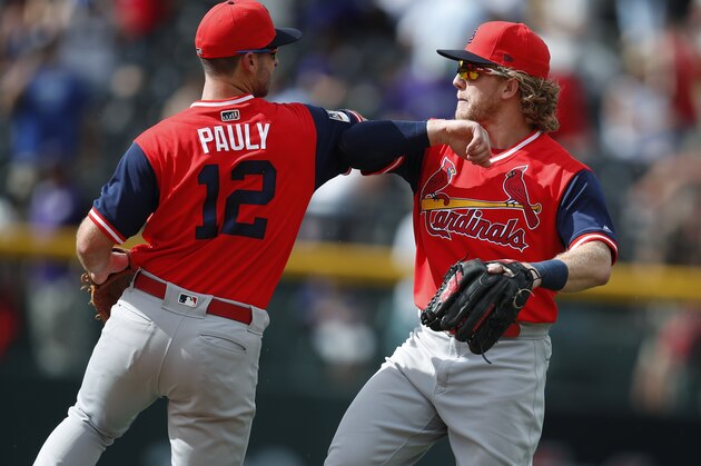 St. Louis Cardinals shortstop Paul DeJong, left, congratulates center fielder Harrison Bader after the ninth inning of a baseball game against the Colorado Rockies, Sunday, Aug. 26, 2018, in Denver. (AP Photo/David Zalubowski)