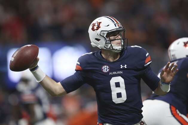 Auburn quarterback Jarrett Stidham (8) works against Georgia during the first half of the Southeastern Conference championship NCAA college football game, Saturday, Dec. 2, 2017, in Atlanta. (AP Photo/John Bazemore)