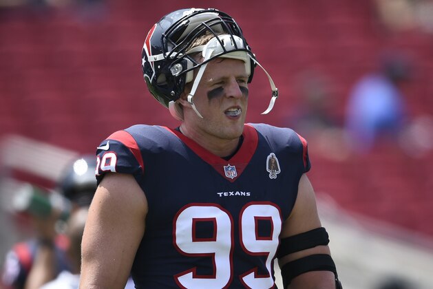 Houston Texans defensive end J.J. Watt watches during warm ups before an NFL preseason football game against the Los Angeles Rams Saturday, Aug. 25, 2018, in Los Angeles. (AP Photo/Kelvin Kuo)