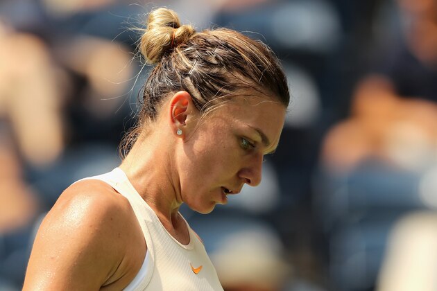 NEW YORK, NY - AUGUST 27:  Simona Halep of Romania reacts in her women's singles first round match against Kaia Kanepi of Estonia on Day One of the 2018 US Open at the USTA Billie Jean King National Tennis Center on August 27, 2017 in the Flushing neighborhood of the Queens borough of New York City.  (Photo by Elsa/Getty Images)
