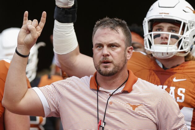 AUSTIN, TX - APRIL 21:  Head coach Tom Herman of the Texas Longhorns leads the team on to the field before the Orange-White Spring Game at Darrell K Royal-Texas Memorial Stadium on April 21, 2018 in Austin, Texas.  (Photo by Tim Warner/Getty Images)