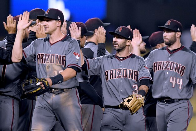 LOS ANGELES, CA - MAY 08:  Daniel Descalso #3 of the Arizona Diamondbacks celebates an 8-5 win over the Los Angeles Dodgers after his three run homerun in the 12th inning at Dodger Stadium on May 8, 2018 in Los Angeles, California.  (Photo by Harry How/Getty Images)