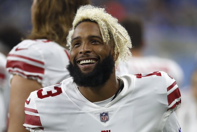 New York Giants wide receiver Odell Beckham smiles on the sidelines during the first half of an NFL football game against the Detroit Lions, Friday, Aug. 17, 2018, in Detroit. (AP Photo/Paul Sancya)