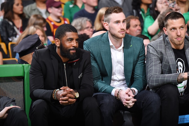 BOSTON, MA - MAY 13:  Kyrie Irving #11 Gordon Hayward #20 and Daniel Theis #27 of the Boston Celtics look on during Game One of the Eastern Conference Finals of the 2018 NBA Playoffs against the Cleveland Cavaliers on May 13, 2018 at the TD Garden in Boston, Massachusetts.  NOTE TO USER: User expressly acknowledges and agrees that, by downloading and or using this photograph, User is consenting to the terms and conditions of the Getty Images License Agreement. Mandatory Copyright Notice: Copyright 2018 NBAE  (Photo by Brian Babineau/NBAE via Getty Images)